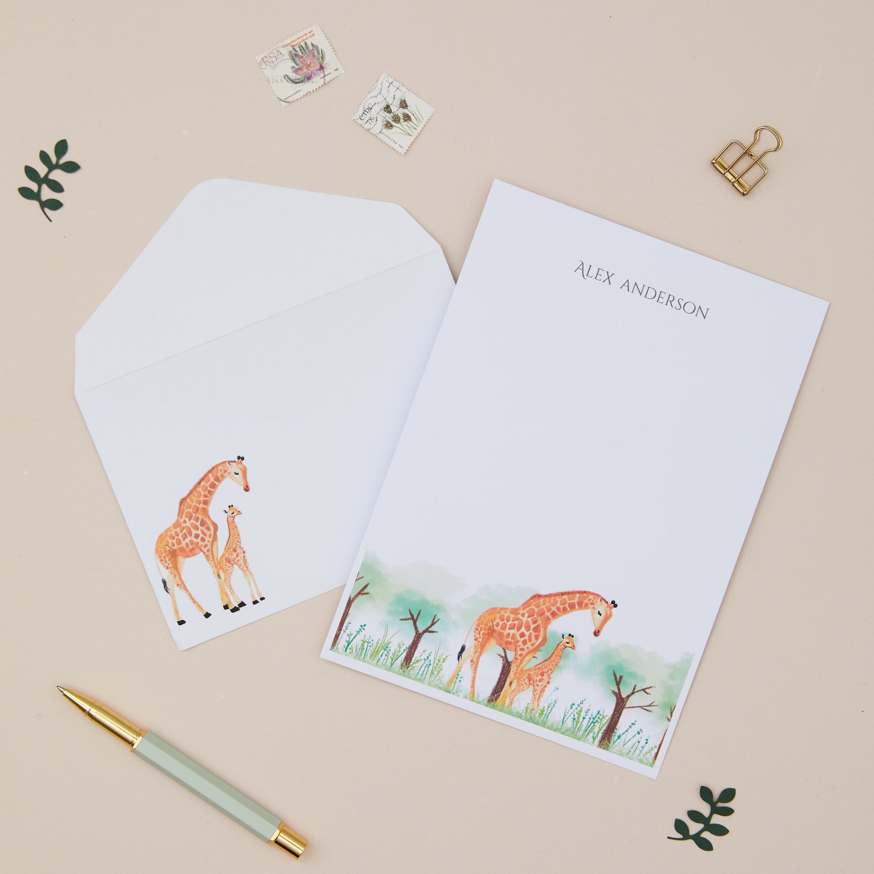 Giraffe Letter Writing Set With Envelopes illustration and matching envelope on a beige background