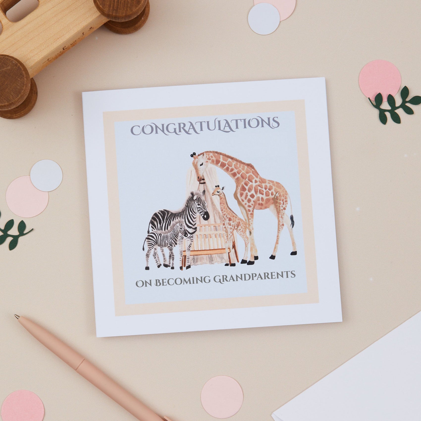 New Grandparents Greeting card with giraffe and zebra illustration on a beige background