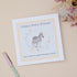 Baby shower card with zebra illustration and text that says happy baby shower, can&