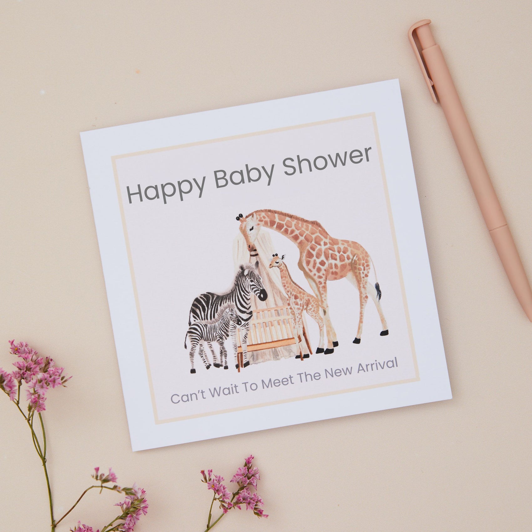 Baby shower card with animal illustrations on a beige background