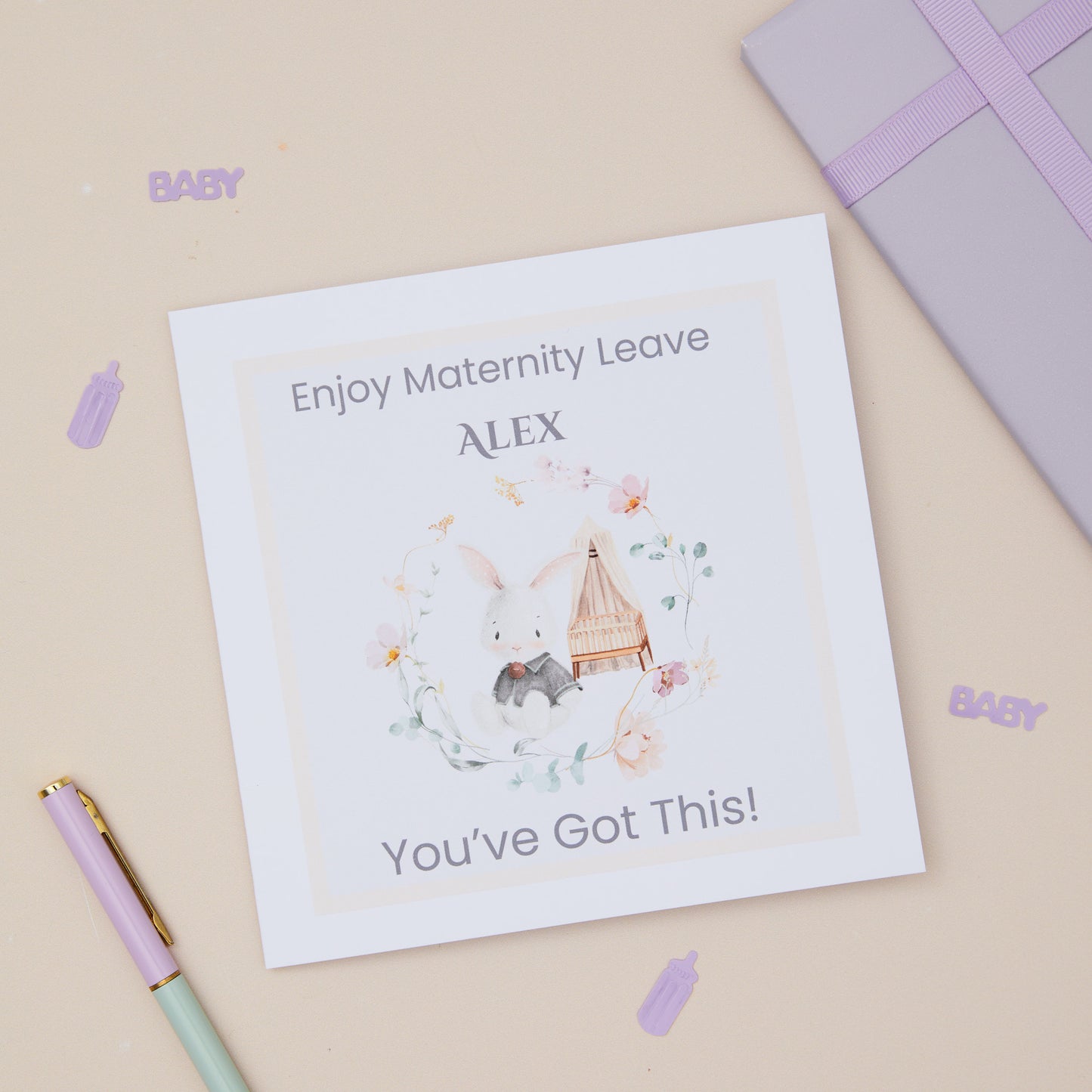 Maternity Leave Card personalised with a bunny rabbit and baby cot surrounding in a floral arrangement