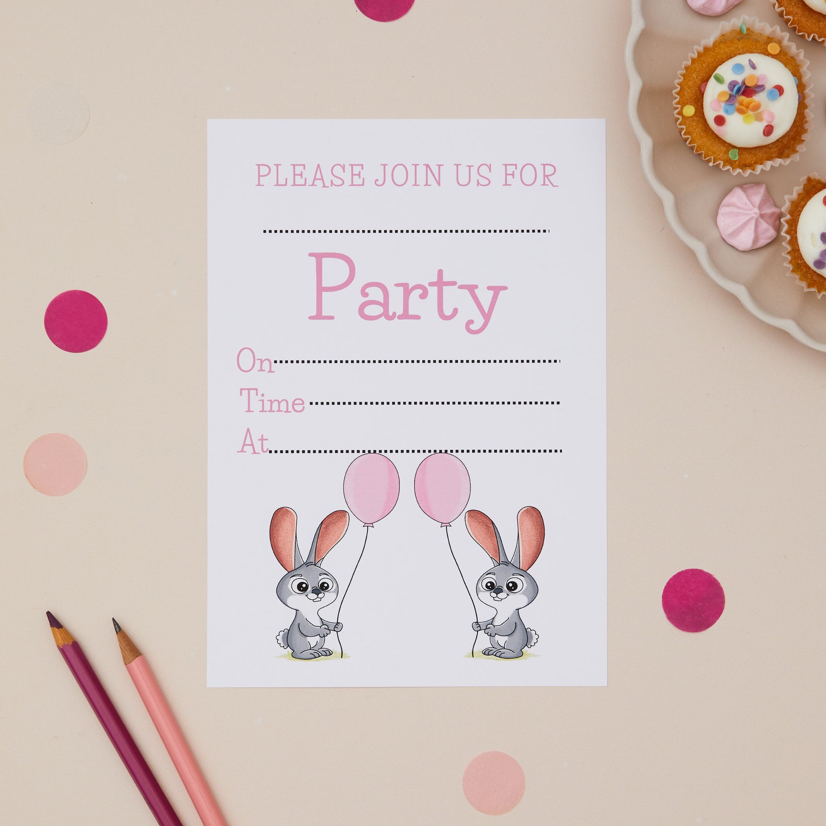 Bunny Rabbit Children ready to write birthday invites. Party invitation card with cartoon bunnies and balloons on a beige background with cupcakes and polka dots.
