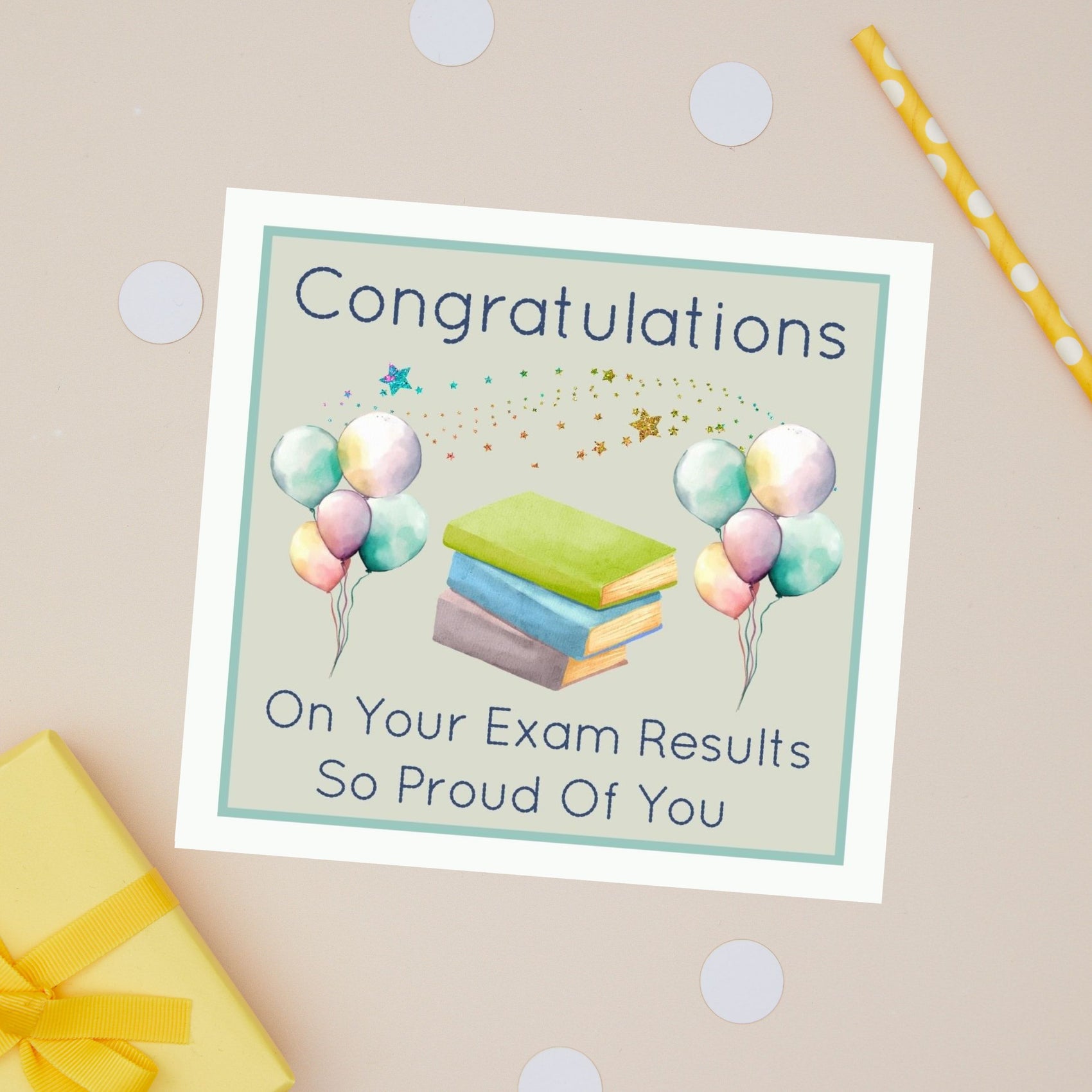 Exam Results Well Done Greeting Card with balloons and books on a beige background. The Card has the text "Congratulations on your exam results - so proud of you"