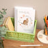 Ideas A5 Wirebound Handmade Notebook. A handmade A5 notebook with a cover featuring a cheetah and baby design, placed on a desk alongside stationery items.