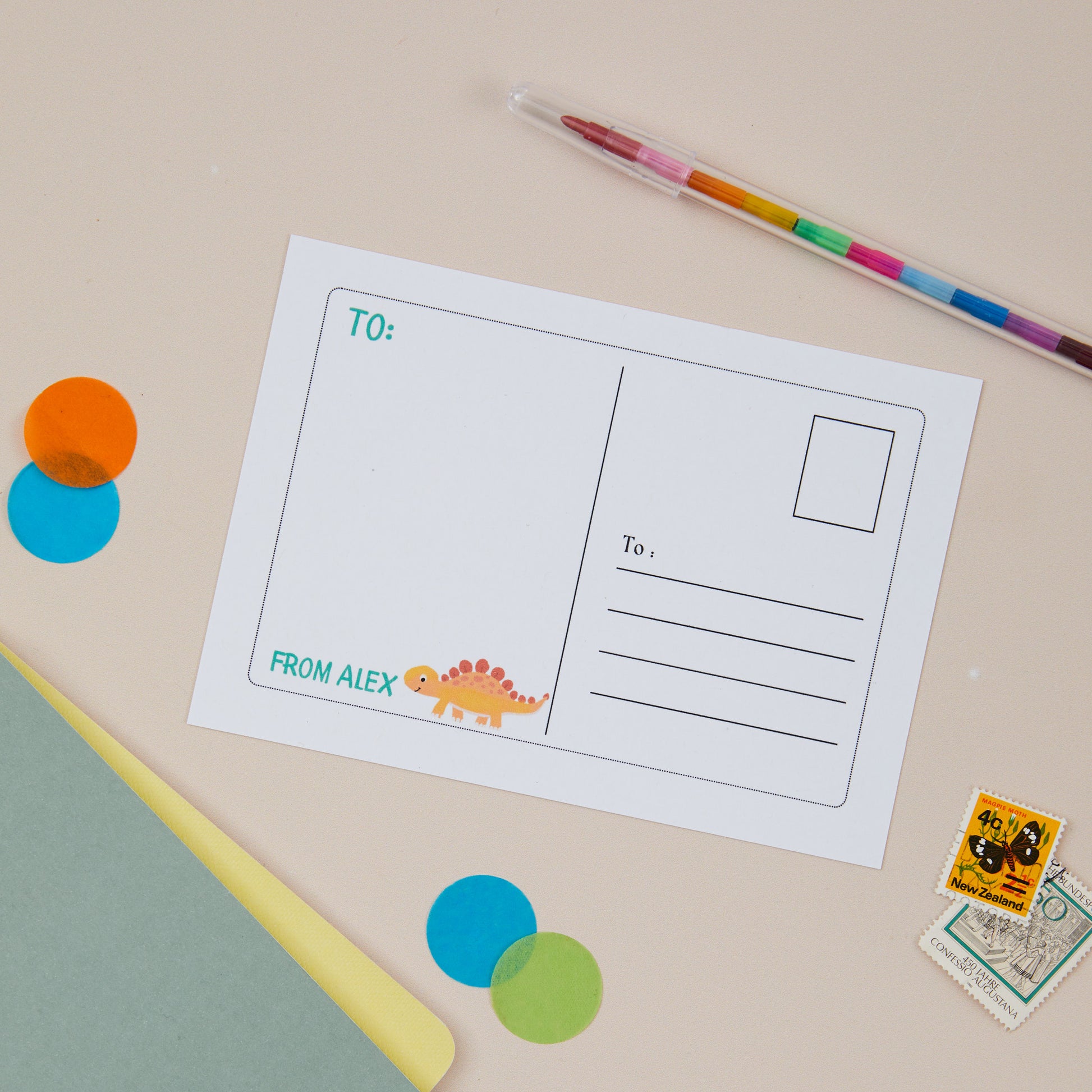 Kids Dinosaur Postcard Set. A back of postcard  illustration of a baby dinosaur on the left side, and the right hand side is postcard style with a postcard style address area