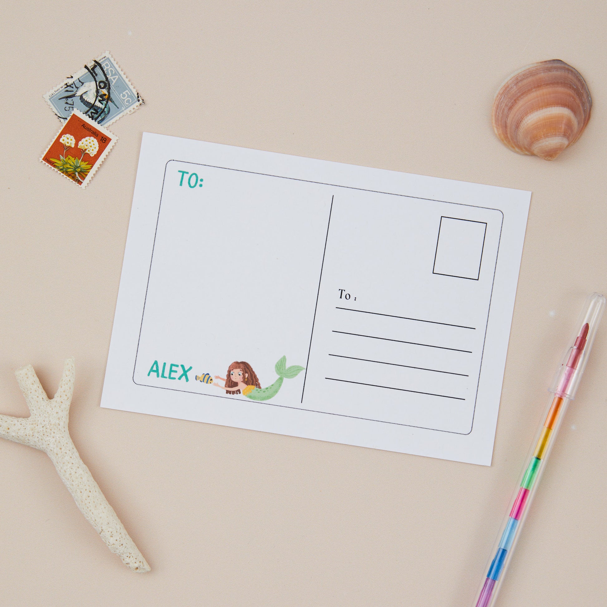 Kids Mermaid Postcard Set. Illustration of the back of postcard  with mermaid illustrations, and the right hand side of the postcard has an area for writing the recipients address