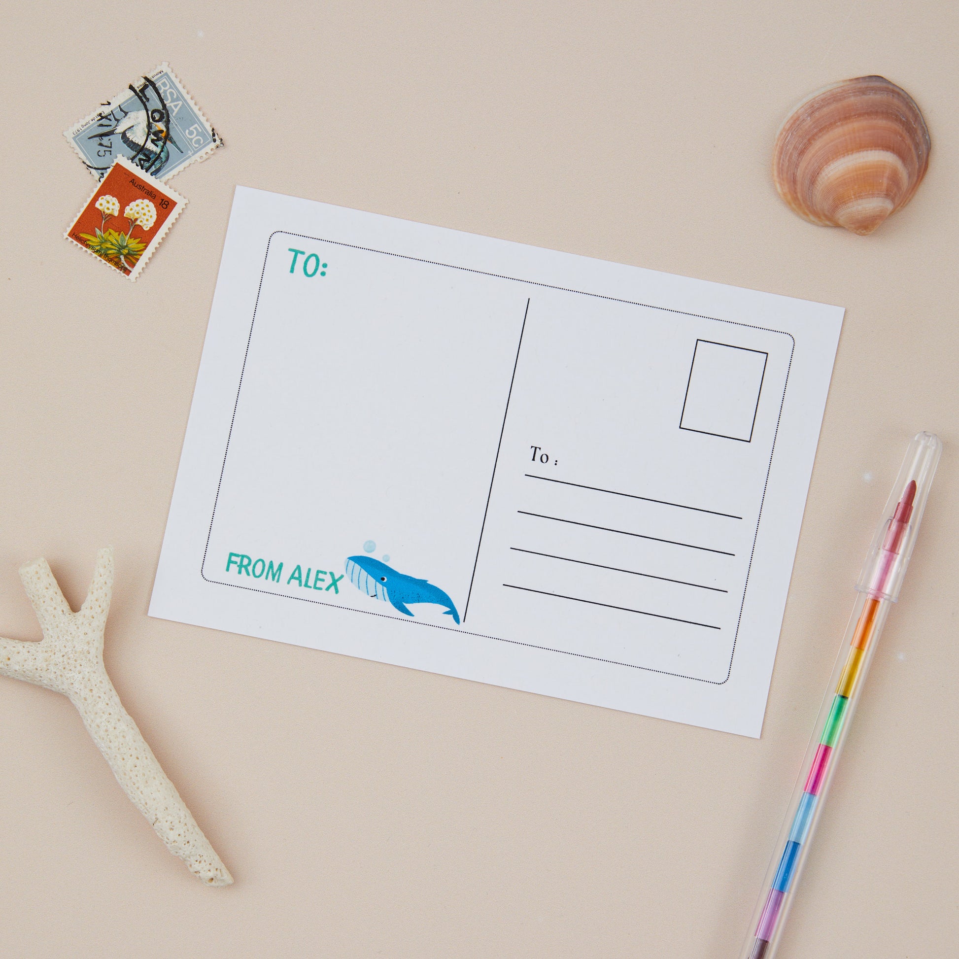 Back of a postcard illusration of a whale, with space to write a personalised message, and also space to include the receipients adddress on the right hand side of the postcard.