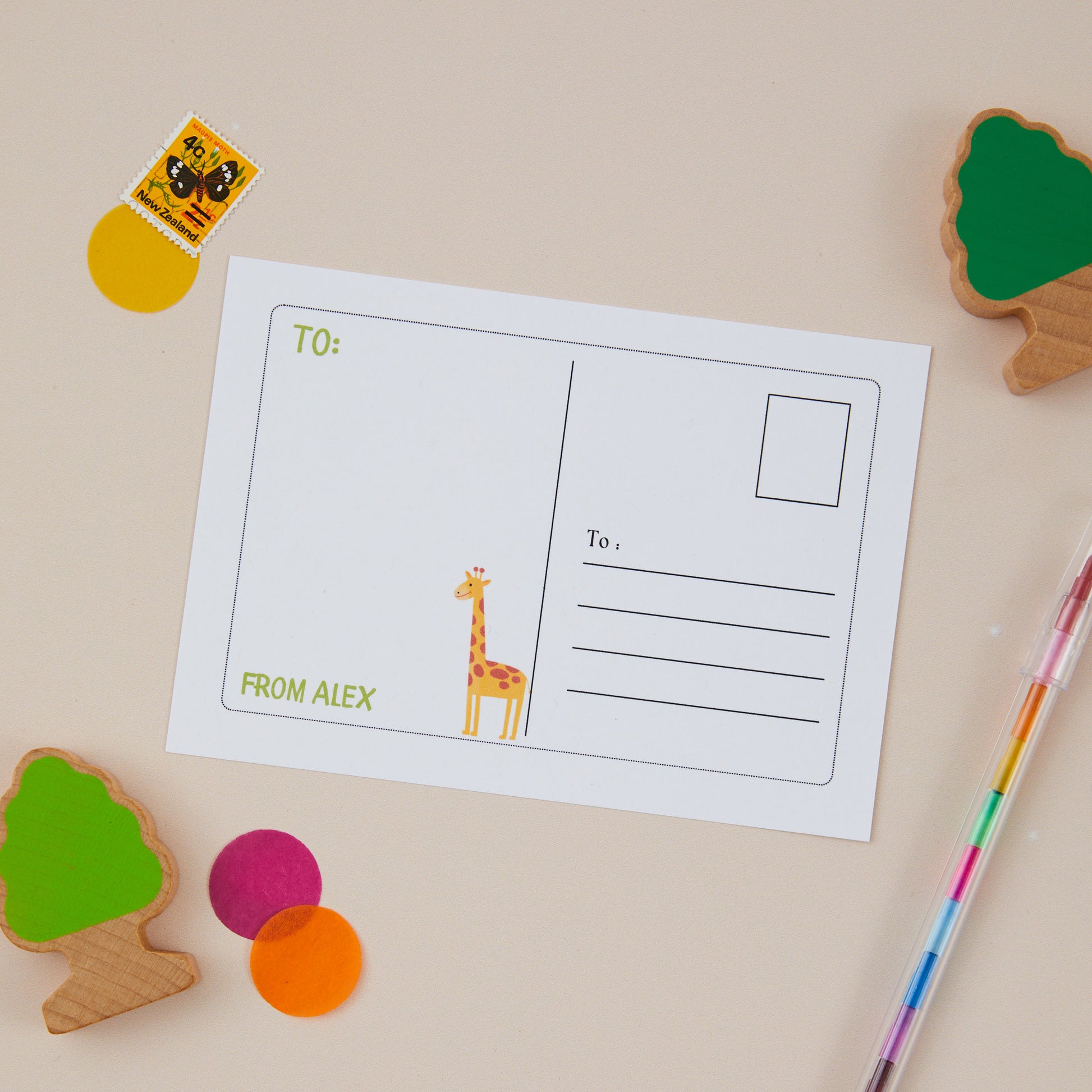 Kids Safari Postcard Set back of postcard, featuring an illustration of a giraffe, and a postcard style area on the right for the recipients address.