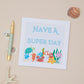 Kids Sealife Birthday Celebration Card with a sea creatures design, titled 'HAVE A SUPER DAY'. The Card is displayed next to a pen and a shell on a neutral background.