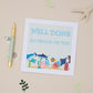 A kids well done greeting card with a 'Well Done' message and a playful sea life design, including a crab, fish, and whale, accompanied by a gold pen on a table with some decorative leaves.
