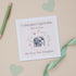 A congratulations card with an illustration of an elephant and a baby daughter, along with the text &