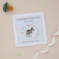 A personalised new baby son card with an illustration of a zebra and its young on a soft blue background, with a yellow border. The card has text congrats on the front and space for a personalized message inside.