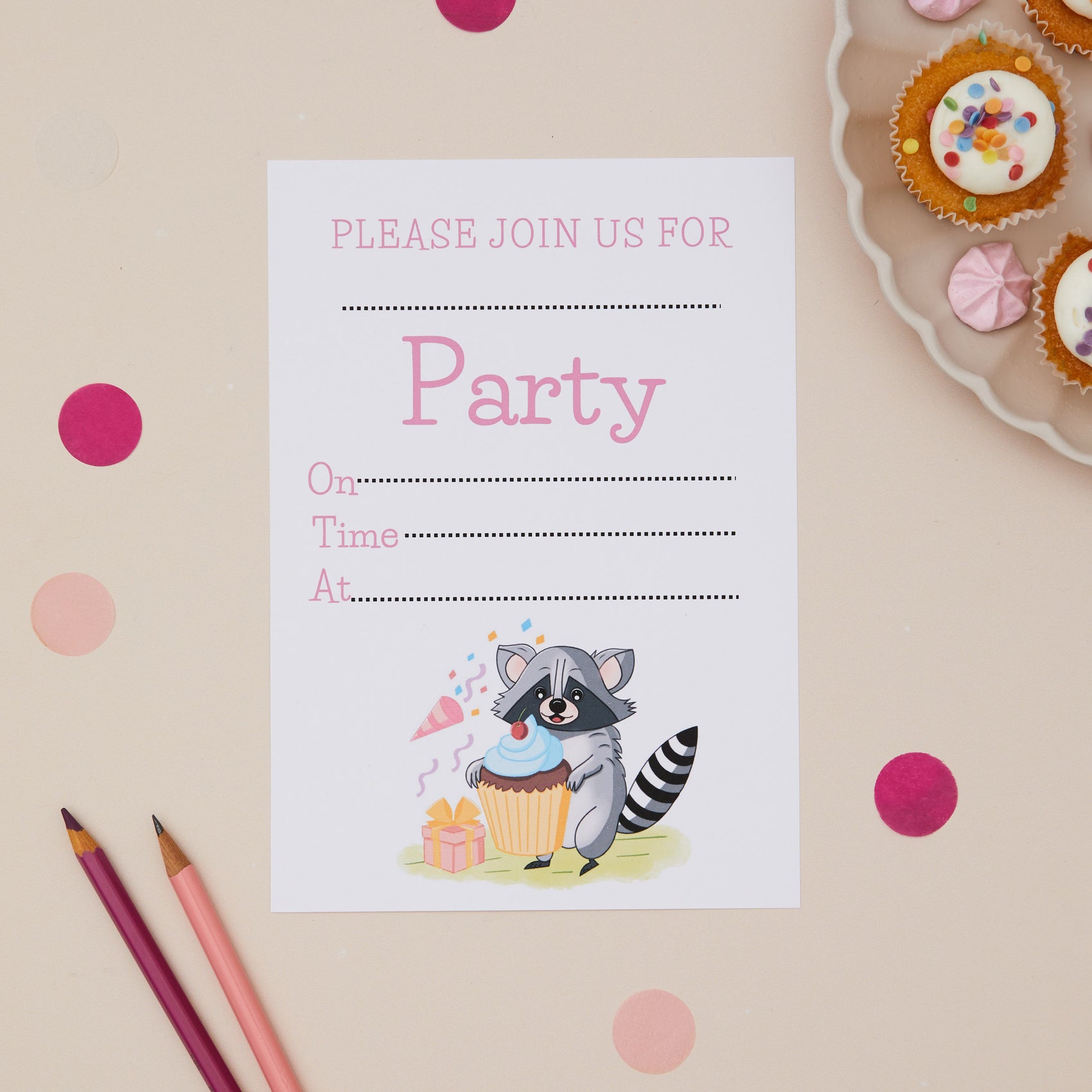 Party Racoon Childrens ready to write birthday invites. Party invitation card with a raccoon and cupcake illustration on a beige background with pink polka dots.