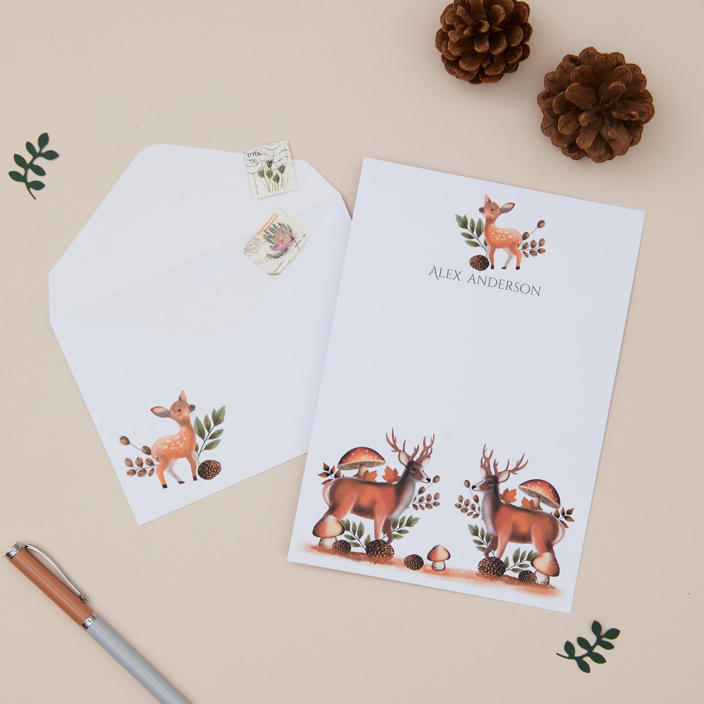 Personalised Deer Letter Writing Set with matching envelopes set against a beige background with woodland element decorations