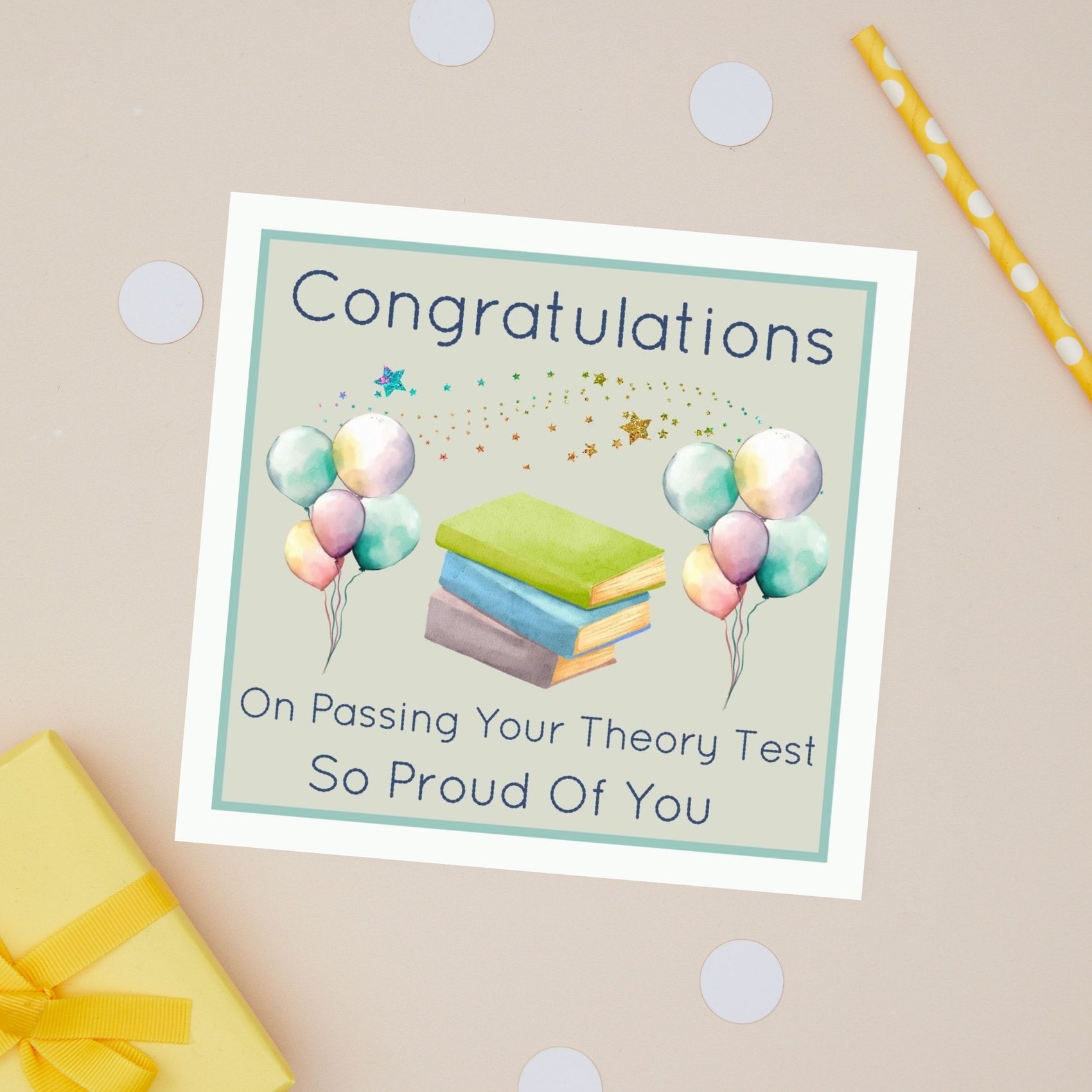 Theory Test Congratulations card with balloons and books on a beige background. The Card has the text "Congratulations on passing your theory test - so proud of you"